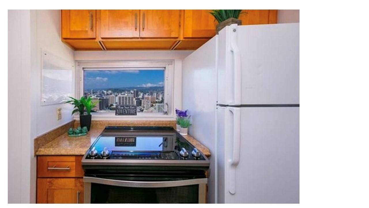A kitchen with wooden cabinets and a stove top oven.